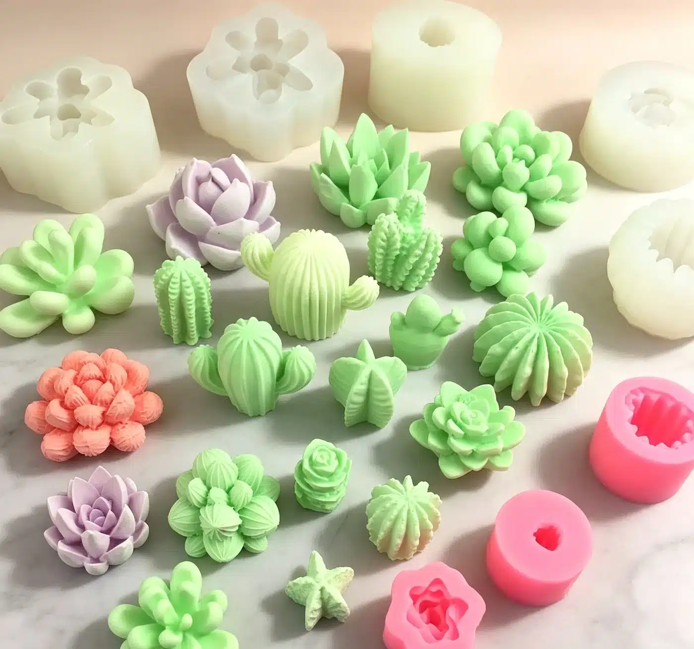Etsy seller holding custom multi-cavity silicone mold tray