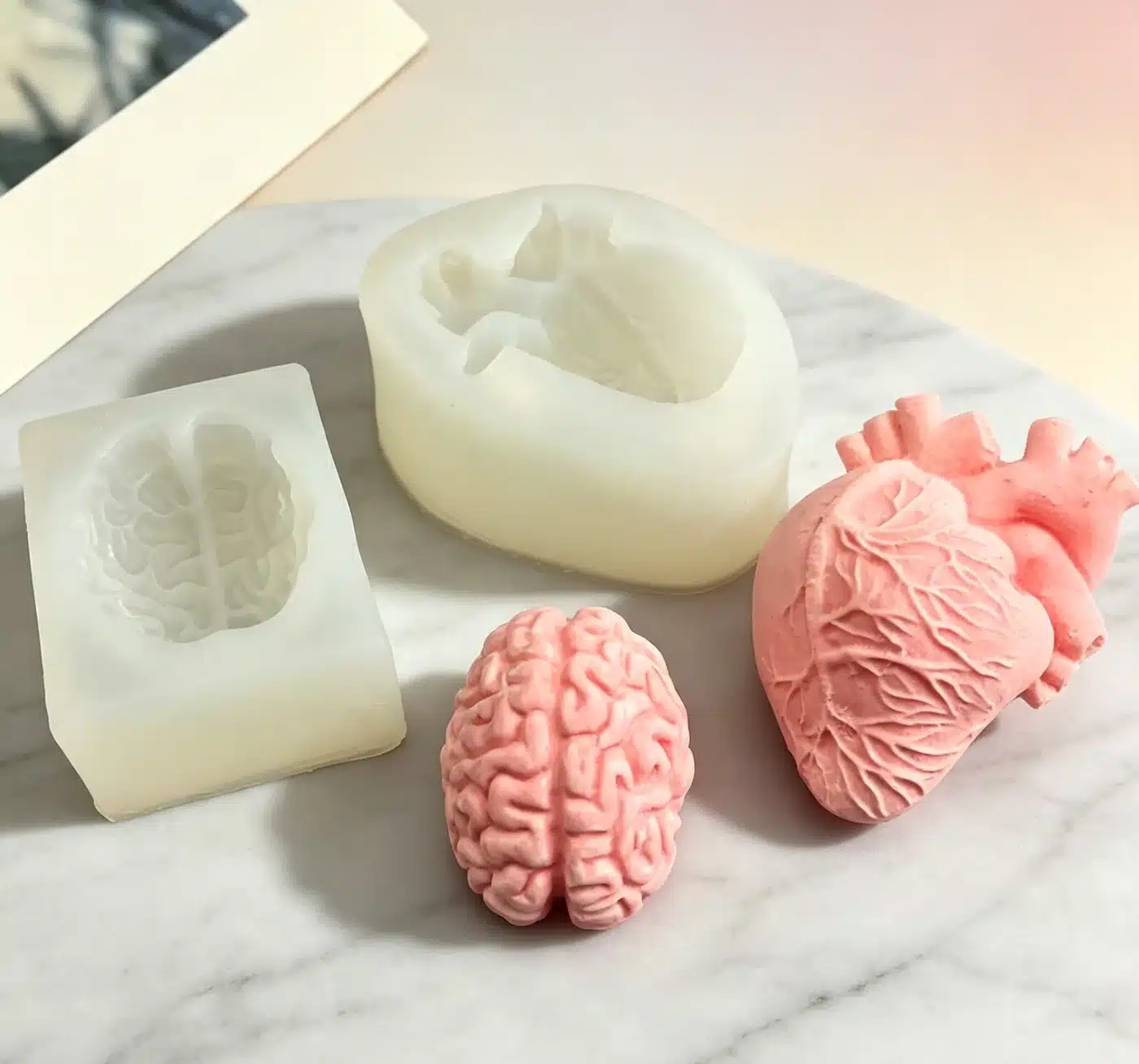Gummy silicone molds staged in workshop for cavity depth and spacing check